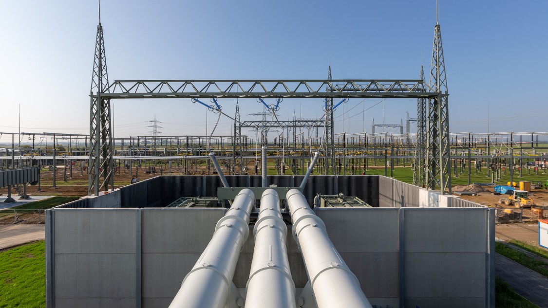 Cross-border interconnectors and synchronous condensers stabilize the grid and improve security of supply; load flow management helps balance power fluctuations